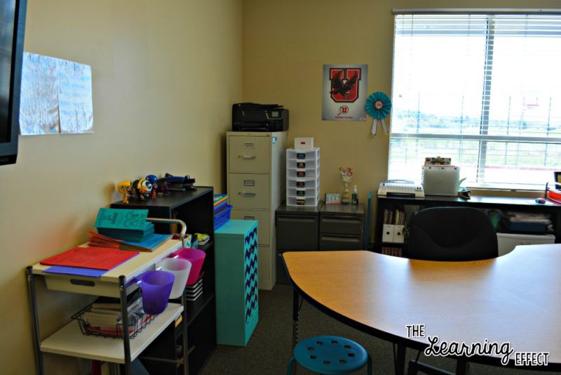 Teacher table and filing cabinets in classroom