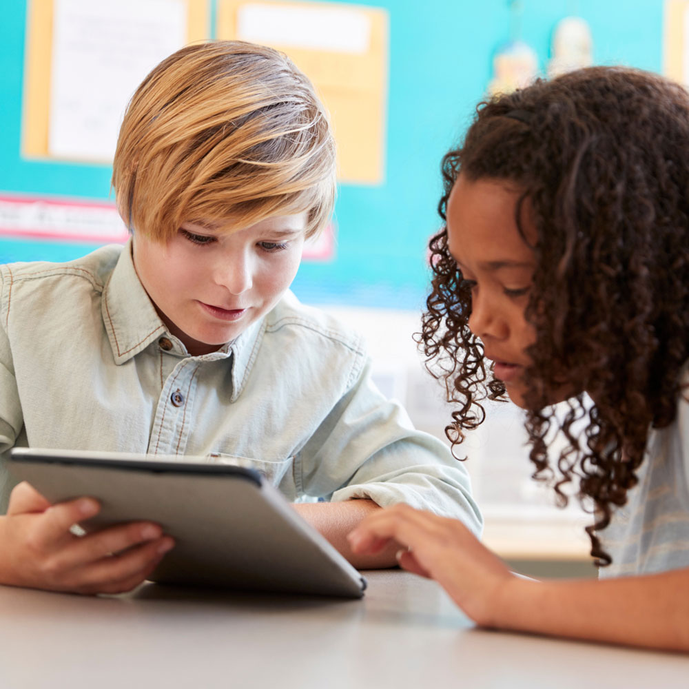 Students collaborating with technology