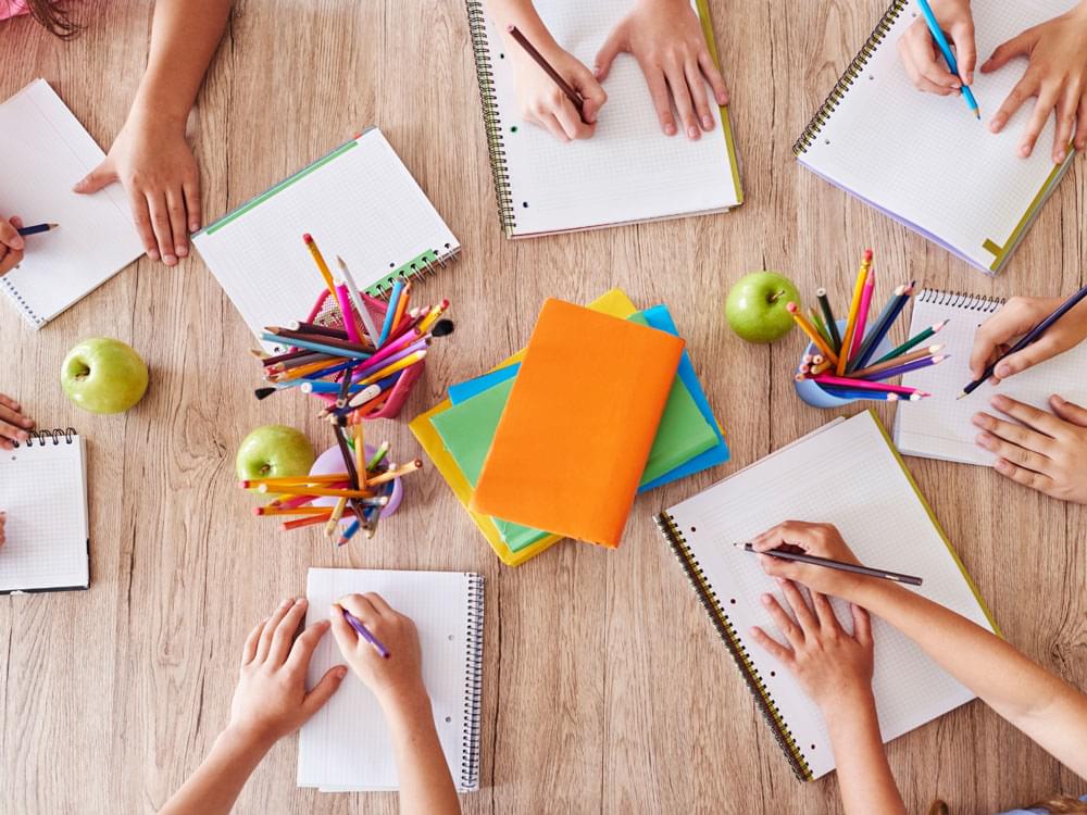 Students writing in notebooks