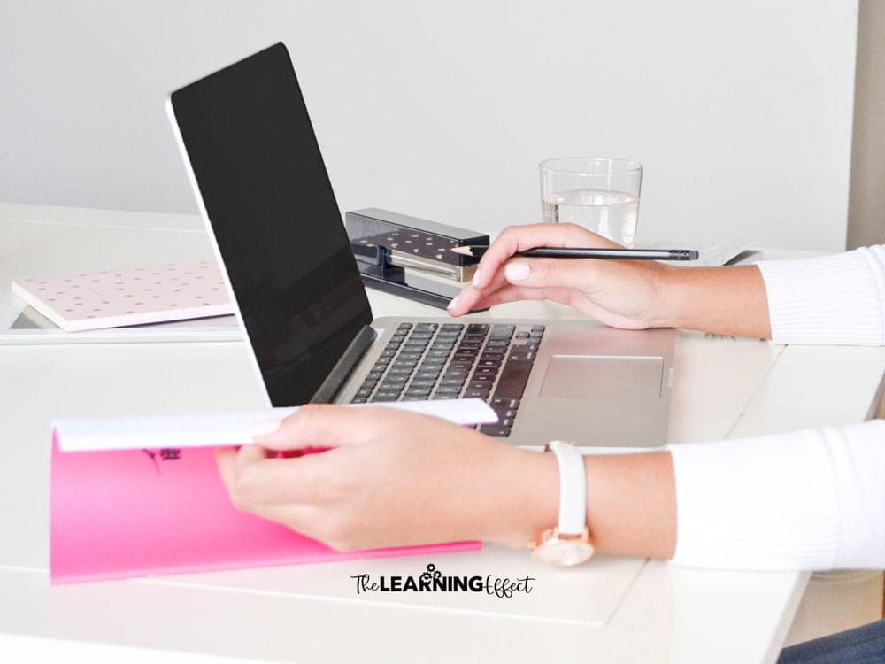 Woman typing on a laptop